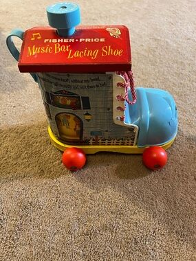 Fisher-Price Red and Blue Music Box Lacing Shoe Toy with Yellow Base